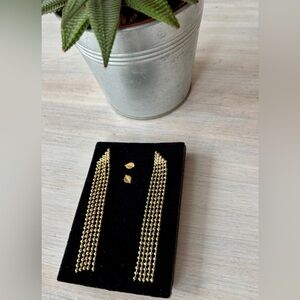 Two sets of earrings: gold drop chain earrings & leaf studs.
